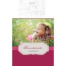 kleines Mädchen liegt auf der Wiese im Gras