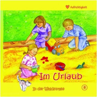 Drei Kinder spielen im Sandkasten